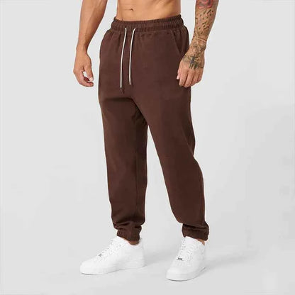 Men's black athletic joggers with side stripe from Mead's Supply & Equipment Outfitters, featuring a comfortable fit and sporty design.