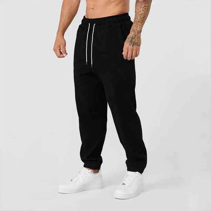Men's black athletic joggers with side stripe from Mead's Supply & Equipment Outfitters, designed for comfort and active wear.