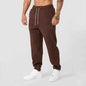 Men's black athletic joggers with side stripe from Mead's Supply & Equipment Outfitters, featuring a comfortable fit and sporty style.