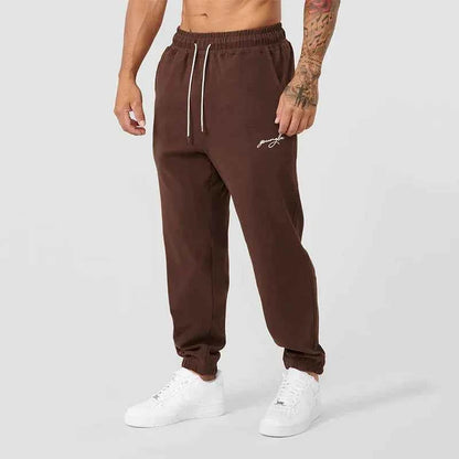 Men's black athletic joggers with side stripe from Mead's Supply & Equipment Outfitters, featuring a comfortable fit and sporty design.