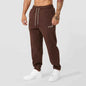 Men's black athletic track sweatpants with side stripe from Mead's Supply & Equipment Outfitters, featuring a comfortable fit and sporty style.