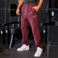 Men's black athletic track sweatpants with side stripe, sporty joggers by Mead's Supply & Equipment Outfitters.