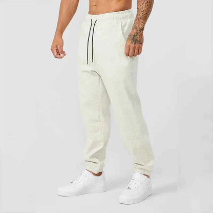 Men's black athletic track sweatpants with side stripe from Mead's Supply & Equipment Outfitters, featuring a comfortable fit and sporty design.