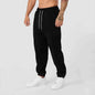 Men's black athletic joggers from Mead's Supply & Equipment Outfitters with side stripe, designed for comfort and active wear.