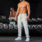Men's black track sweatpants by Mead's Supply & Equipment Outfitters with athletic fit and side stripe for comfortable active wear.