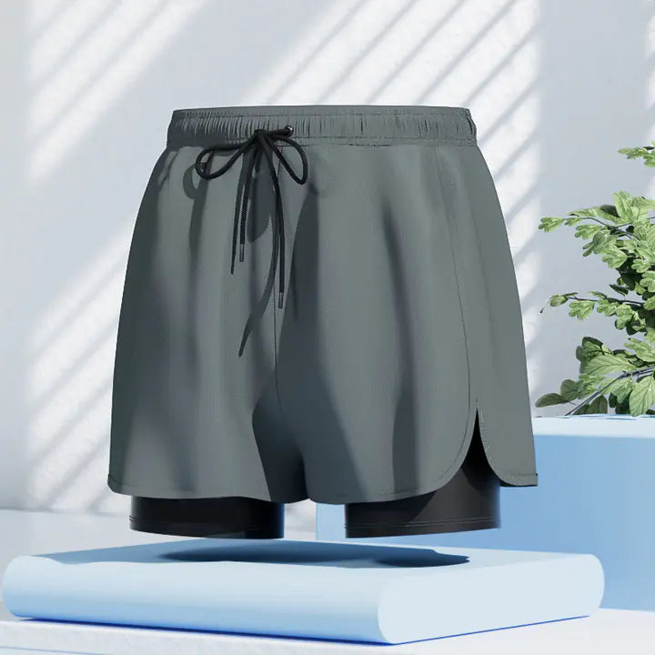 Men's quick-dry swim trunks from Mead's Supply & Equipment Outfitters, black beach shorts with a stroke design, size 2XL.