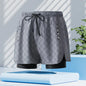 Men's black quick-dry swim trunks from Mead's Supply & Equipment Outfitters, featuring a bold stroke design, size 2XL.