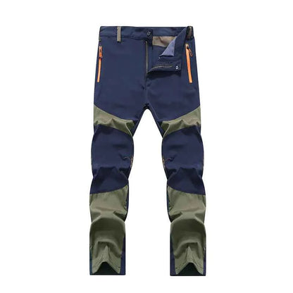 Men's windproof climbing pants by Mead's Supply & Equipment Outfitters in blue, breathable, moisture-wicking outdoor trousers for hiking and trekking.