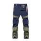 Men's windproof climbing pants by Mead's Supply & Equipment Outfitters in blue, breathable, moisture-wicking outdoor trousers for hiking and trekking.