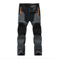 Men's dark blue waterproof and windproof hiking pants by Mead's Supply & Equipment Outfitters, with stretch and wear-resistant outdoor fabric.