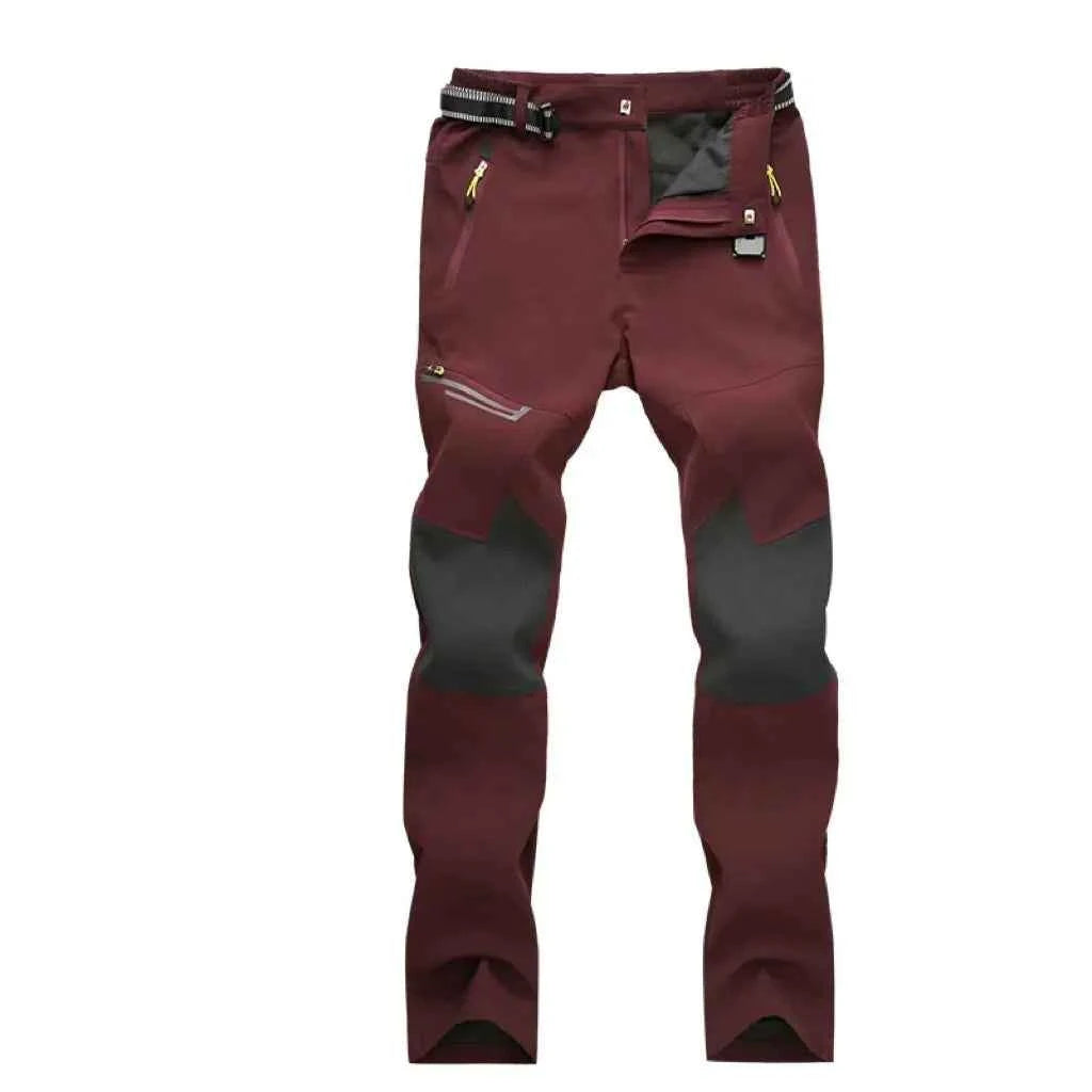 Unisex waterproof hiking pants in black made of breathable polyester, designed for outdoor adventures and couples hiking gear.
