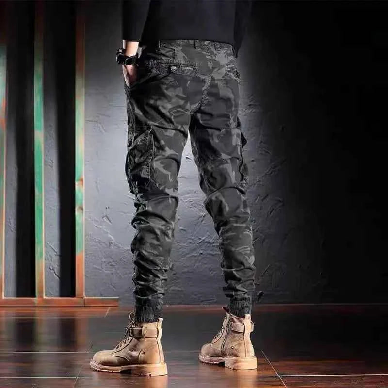 Men's oversized camouflage cargo pants with multiple pockets, outdoor tactical trousers by Mead's Supply & Equipment Outfitters.