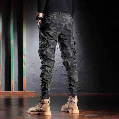 Men's oversized camouflage cargo pants with multiple pockets, outdoor tactical trousers by Mead's Supply & Equipment Outfitters.