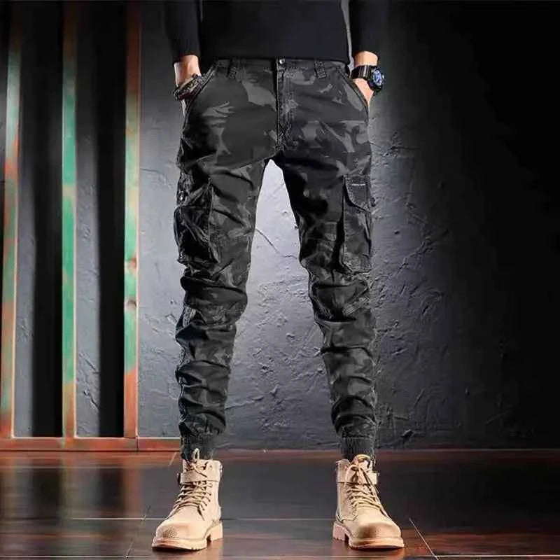 Men's oversized camouflage cargo pants by Mead's Supply & Equipment Outfitters, multi-pocket outdoor trousers in khaki color.