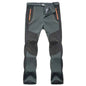 Army green unisex outdoor hiking pants from Mead's Supply & Equipment Outfitters, made of cotton with multiple pockets for trekking.
