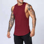 White men's loose cotton sleeveless singlet from Mead's Supply & Equipment Outfitters, shown on a hanger.