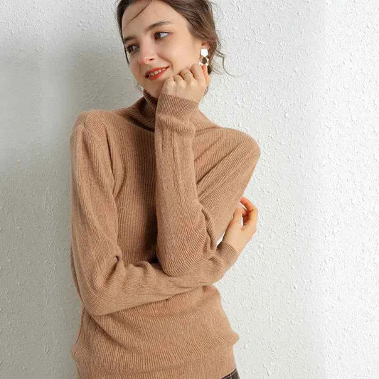 Beige women's 100% Merino wool turtleneck sweater with slim fit and high neck, ideal for autumn and winter layering.