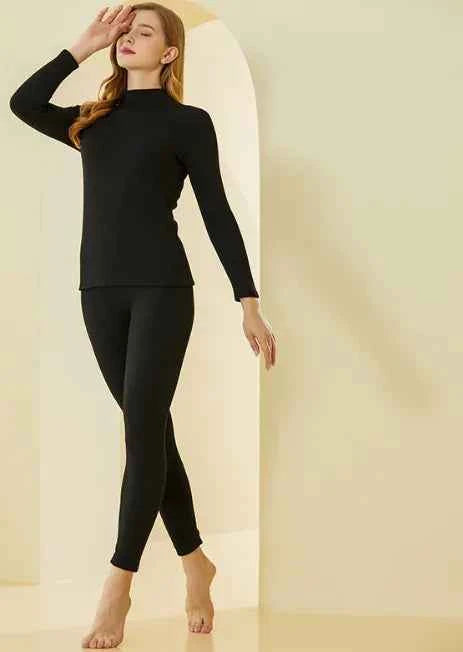 Women's black lamb cashmere thermal base layer set by Mead's Supply & Equipment Outfitters, second skin fit for winter warmth.
