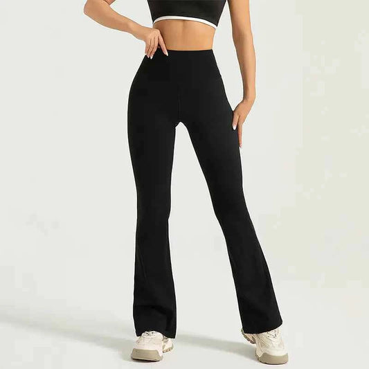 Gray high waist flared yoga pants with hip-lifting bell bottom design, women's athletic wear by Mead's Supply & Equipment Outfitters.
