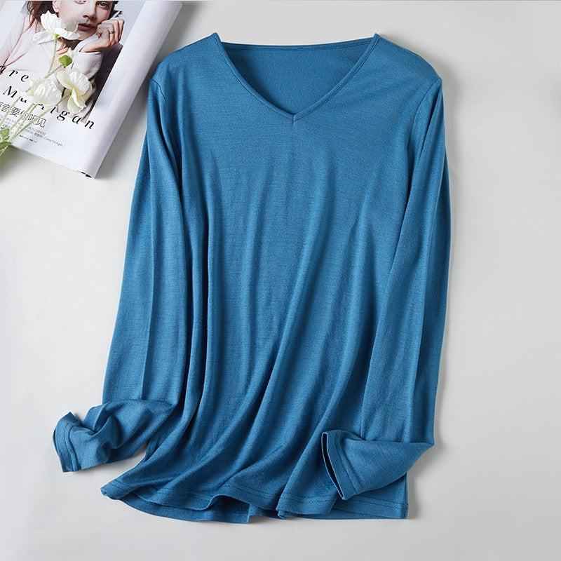 Women's V-Neck Merino Wool Thermal Base Layer by Mead's Supply, slim fit long sleeve in lake blue, ideal for winter layering.