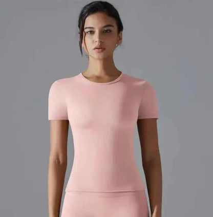 Light pink women's solid color sport T-shirt from Mead's Supply & Equipment Outfitters limited, designed for active wear.