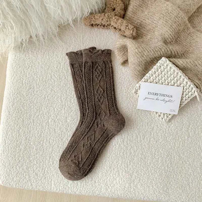 Thick diamond-shaped wool mid-thigh socks for women by Mead's Supply & Equipment Outfitters, perfect for fall and winter warmth.