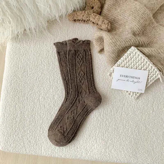 Thick diamond-shaped wool mid-thigh socks for women by Mead's Supply & Equipment Outfitters, perfect for fall and winter warmth.