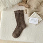 Thick diamond-shaped wool mid-thigh socks for women by Mead's Supply & Equipment Outfitters, perfect for fall and winter warmth.