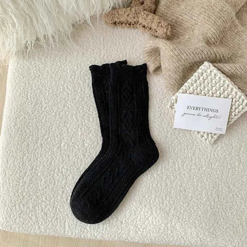 Women's wool mid-thigh socks with diamond pattern, warm and cozy leg warmers for fall and winter by Mead's Supply & Equipment.