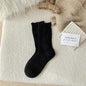 Women's wool mid-thigh socks with diamond pattern, warm and cozy leg warmers for fall and winter by Mead's Supply & Equipment.