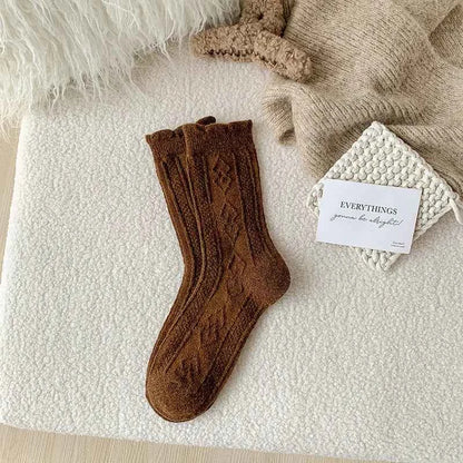 Thick diamond-shaped wool mid-thigh socks for women, warm cozy leg warmers ideal for fall and winter.