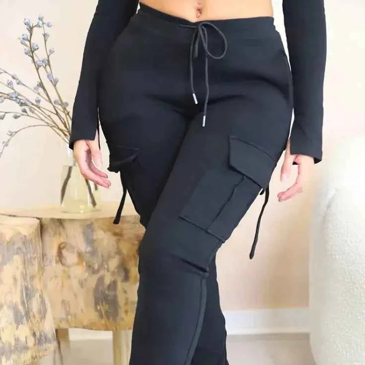 Pink high-waist utility cargo pants for women with wide legs and multiple pockets, featuring a drawstring waist by Mead's Supply & Equipment.