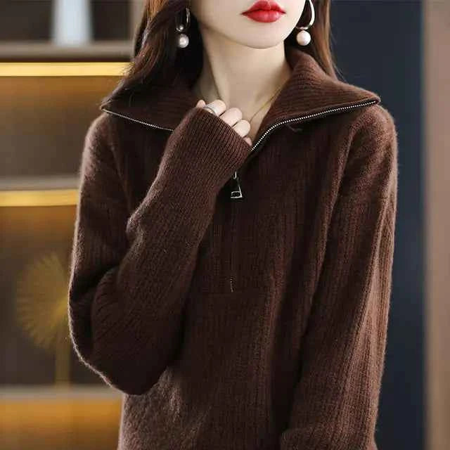 Red women's Merino wool turtleneck sweater with zipper front and loose fit, designed for winter warmth by Mead's Supply & Equipment.