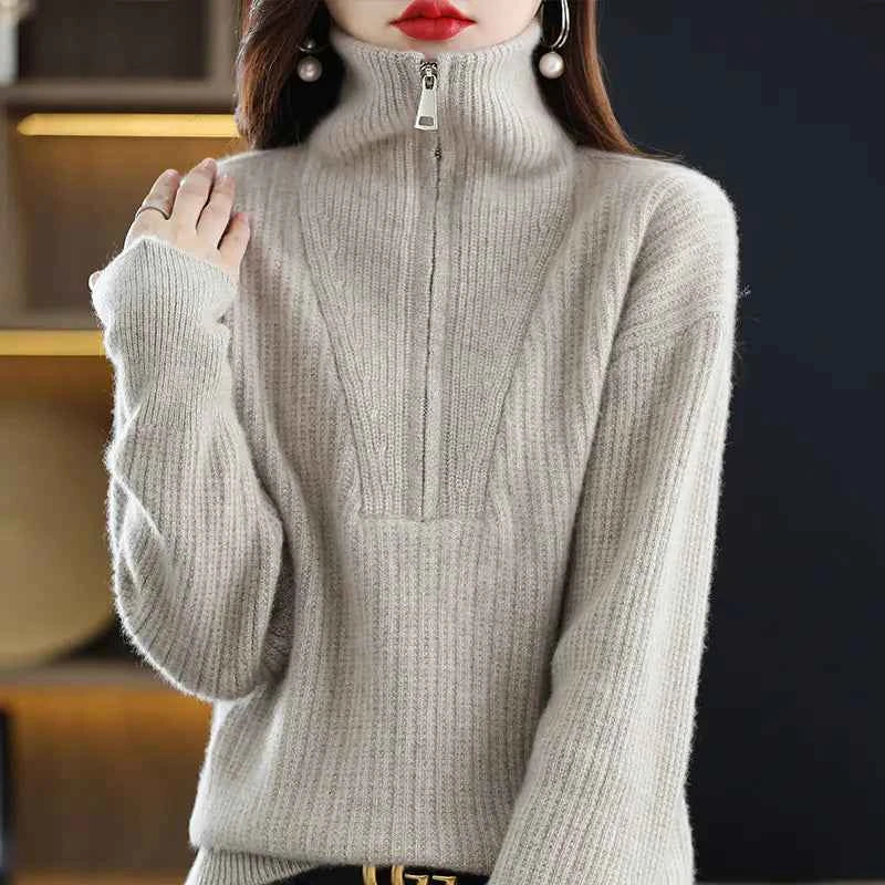 Women's red 100% Merino wool turtleneck sweater with zipper front, loose fit, designed for winter warmth by Mead's Supply & Equipment Outfitters.