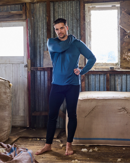 Men's black Merino 365 NZ base pants made from 100% Merino wool, shown in black, designed for comfort and warmth.