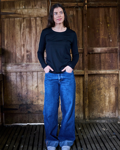 Black women's long sleeve shirt made from 100% Merino wool by Merino 365 NZ, shown on a model.