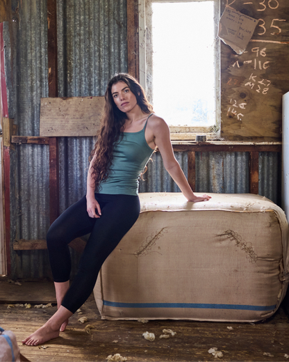 Women’s Merino 365 NZ Base Pant in black, 100% merino wool, slim-fit women’s pants, cozy and breathable for outdoor wear.