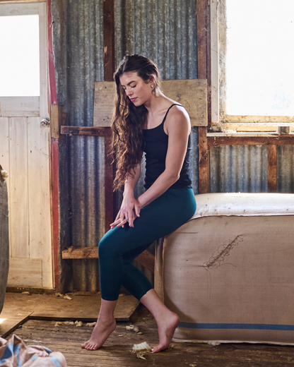 Women's Merino 365 NZ Base Pant in Pine, made from 100% Merino Wool, featuring a comfortable fit and natural wool texture.