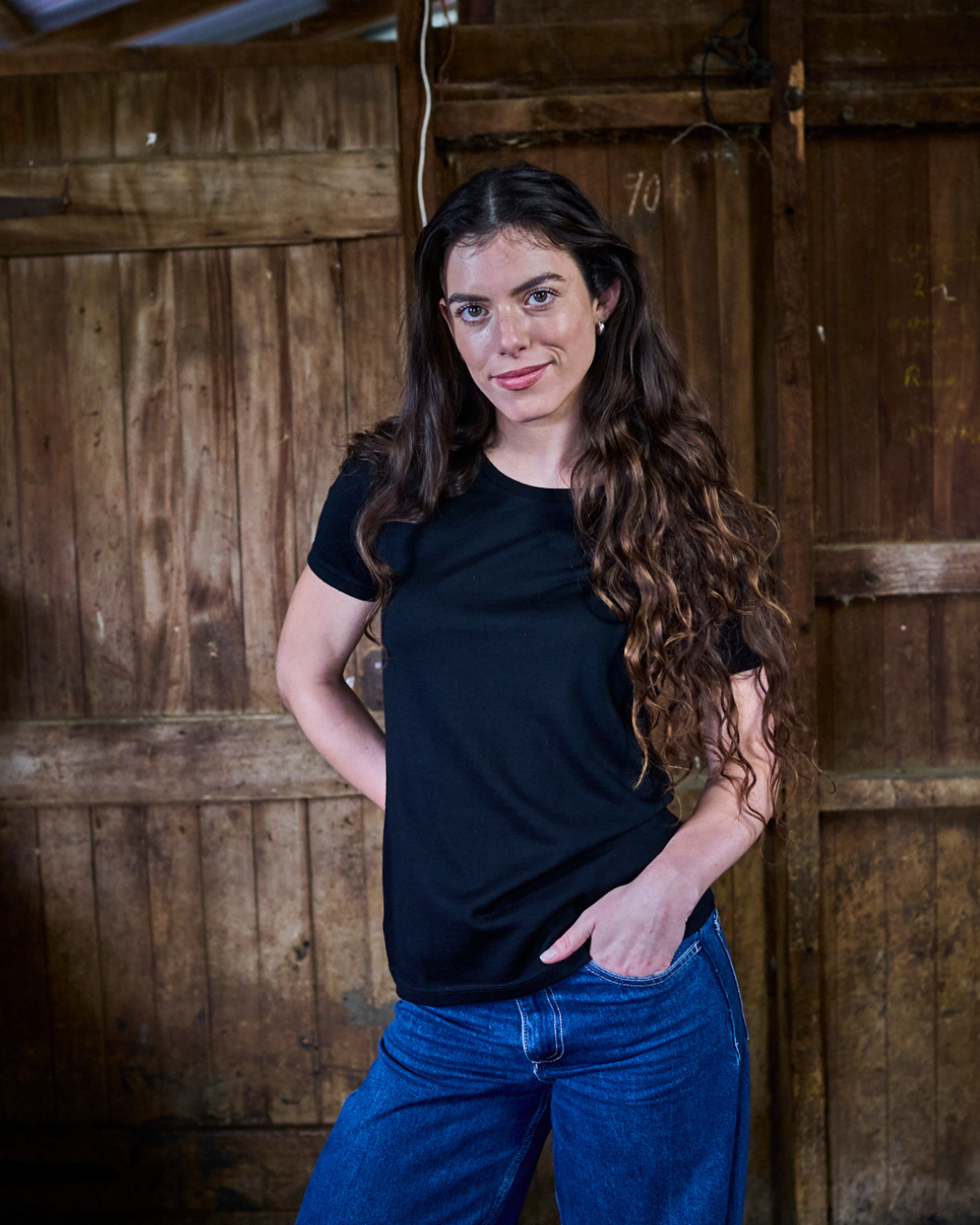 Black women's crew T-shirt made of 100% Merino Wool by Merino 365 NZ, showcasing a comfortable, fitted design.