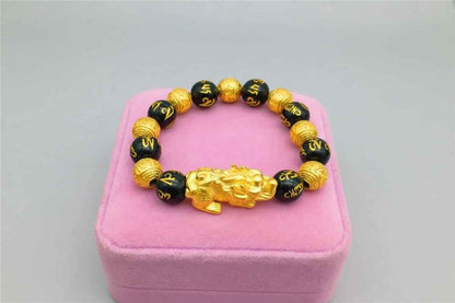 Stylish 3Sixty5 gold bracelet with black beads, featuring a sleek and elegant design for everyday wear.