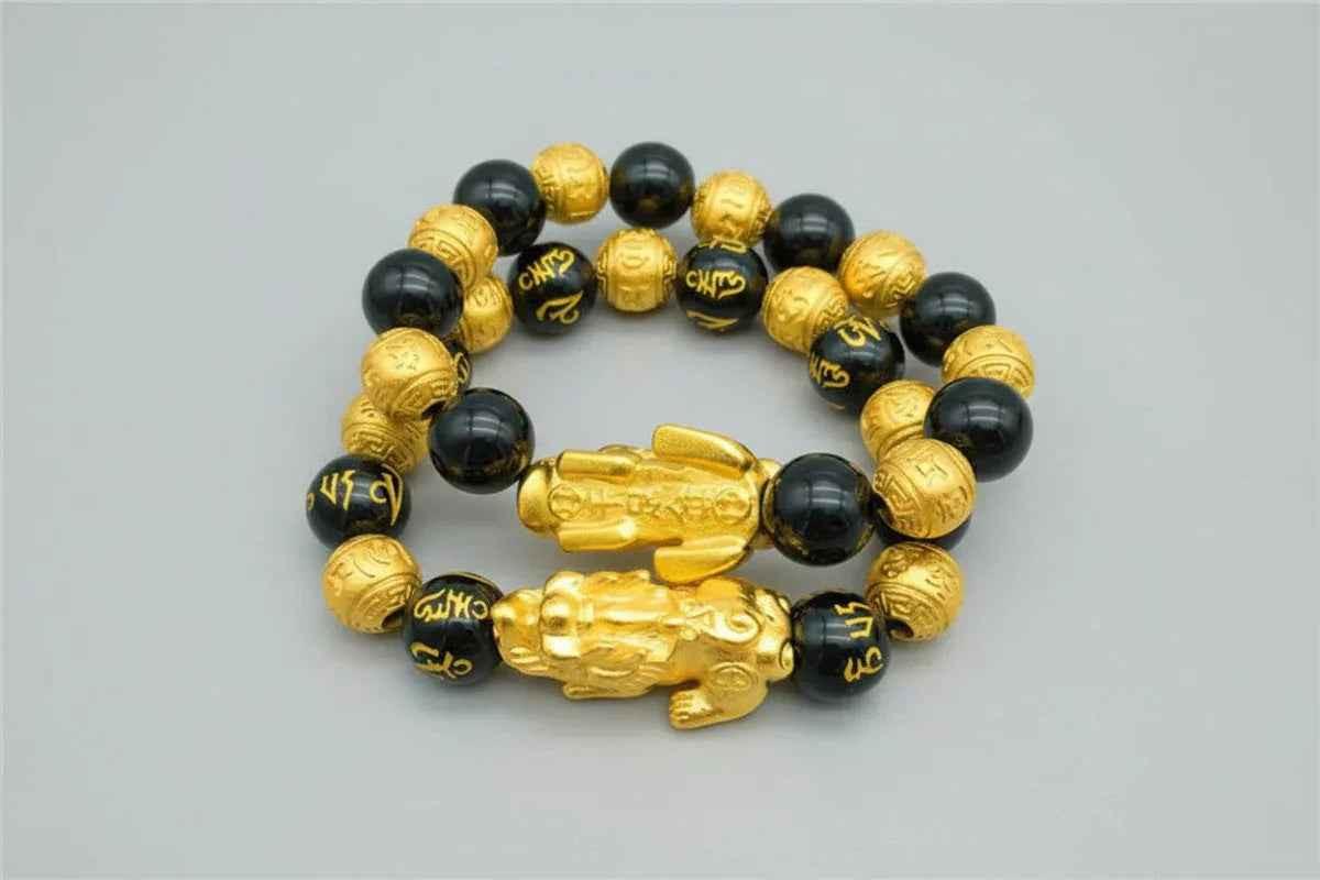 Stylish 3Sixty5 gold bracelet with black beads, featuring a sleek design and adjustable fit, perfect for accessorizing any outfit.