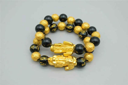 Stylish 3Sixty5 gold bracelet with black beads, featuring a sleek design and adjustable fit, perfect for accessorizing any outfit.