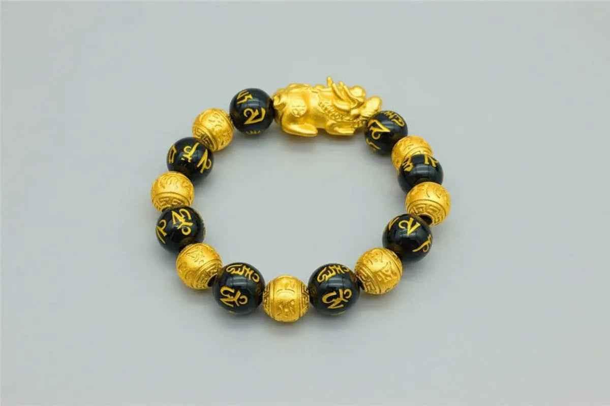 Stylish 3Sixty5 gold bracelet with black beads, featuring a sleek design and smooth bead details.