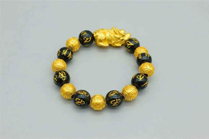 Stylish 3Sixty5 gold bracelet with black beads, featuring a sleek design and smooth bead details.