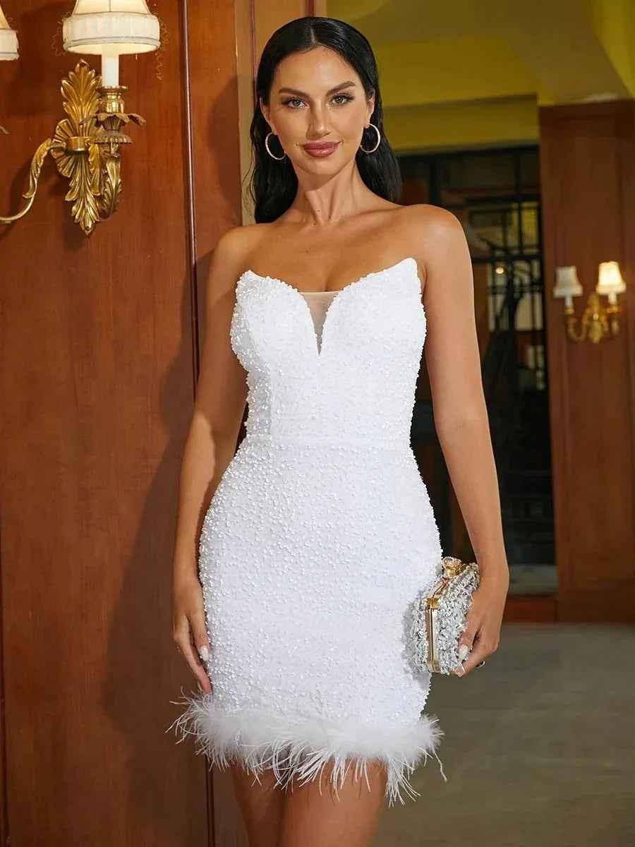 White women's feather trim cocktail dress by Stylish 3Sixty5, featuring elegant feather details and a stylish silhouette.
