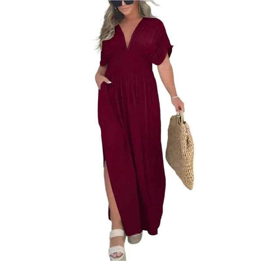 Stylish 3Sixty5 khaki summer dress with a slit, featuring a chic, flowy design perfect for warm weather.