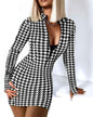 White and black zipper V-neck long sleeve bodycon dress by Stylish 3Sixty5, form-fitting with a sleek design.