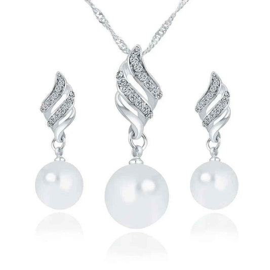 Stylish 3Sixty5 pearl jewelry gift set featuring gold-tone necklace, earrings, and bracelet with elegant pearl accents.