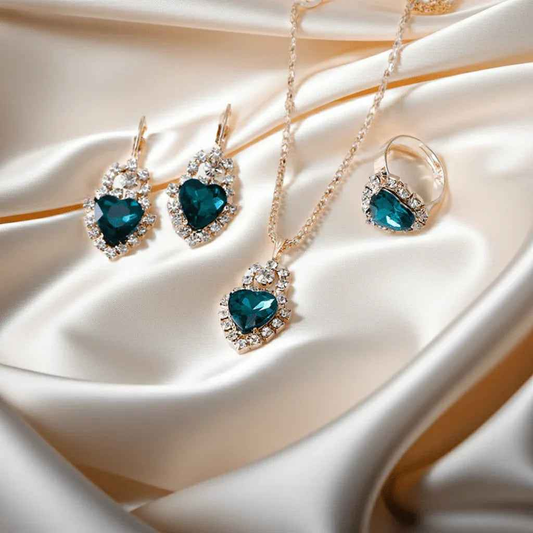 Stylish 3Sixty5 rhinestone splash jewelry set with heart-shaped royal blue stones, featuring earrings and necklace.
