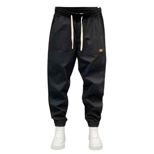 Black Stylish 3Sixty5 urban seasonal jogger trousers, made of comfortable fabric with a relaxed fit and elastic waistband.